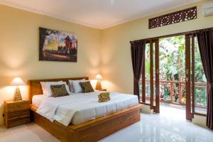 Voodi või voodid majutusasutuse Alam Pangkung Ubud toas