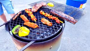 a grill with meat and vegetables on it at Süntelhof in Hessisch Oldendorf