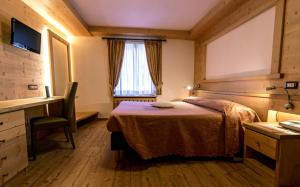 Postel nebo postele na pokoji v ubytování Hotel Siera Hof