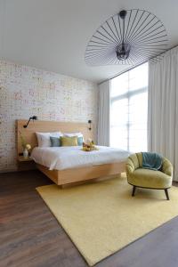 Un pat sau paturi într-o cameră la Boutique Hotel Catshuis
