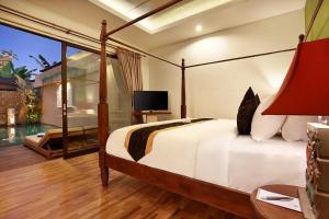 Llit o llits en una habitació de Kamajaya Villas