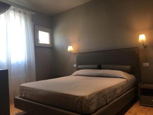 Postel nebo postele na pokoji v ubytování B&B SILVIA