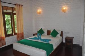 Katil atau katil-katil dalam bilik di Liyon Rest sigiriya