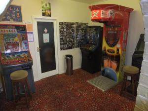 a room with two arcade machines and a video game at Charnley Gold in Blackpool