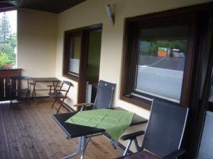 a room with a table and chairs and a window at Pension Hartmann in Sankt Kanzian