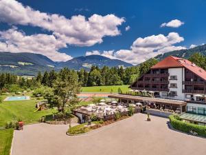 an aerial view of the resort with mountains in the background at Royal Hotel Hinterhuber in Brunico