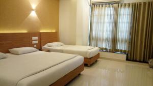 Hotel Kapilavasthu客房内的一张或多张床位