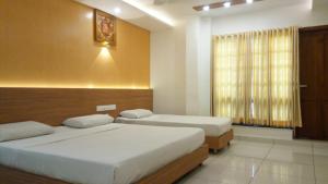 Hotel Kapilavasthu客房内的一张或多张床位
