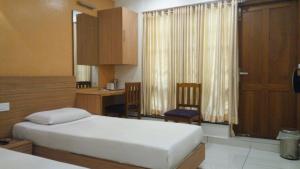 Hotel Kapilavasthu客房内的一张或多张床位