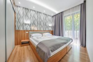 Posteľ alebo postele v izbe v ubytovaní Apartamenty Cypel Helski