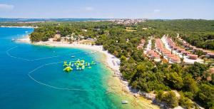 an aerial view of a beach with boats in the water at Apartments Vitae in Pula