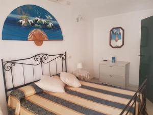 A bed or beds in a room at La Casetta Blu