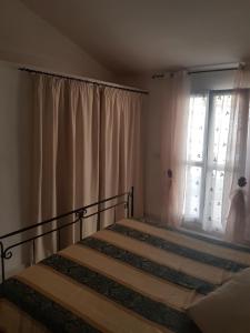 A bed or beds in a room at La Casetta Blu