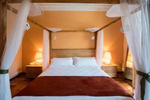 Postel nebo postele na pokoji v ubytování Hotel La Posada De Alameda