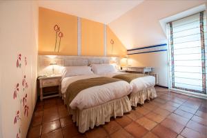 Postel nebo postele na pokoji v ubytování Hotel La Posada De Alameda