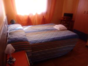 Voodi või voodid majutusasutuse Albergo alla Pineta toas