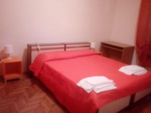 Voodi või voodid majutusasutuse Albergo alla Pineta toas