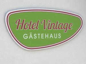 a sign for a hotel vintage gas station at La Maison Vintage in Cochem