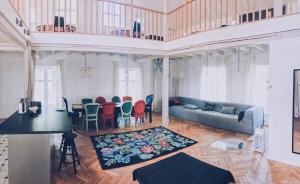 a living room with a couch and a table and chairs at Casa Mia XIX-w Nadmorski Dom z ogrodem in Cedry Małe
