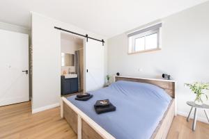 Een bed of bedden in een kamer bij Zilte Hoeve Zoutelande