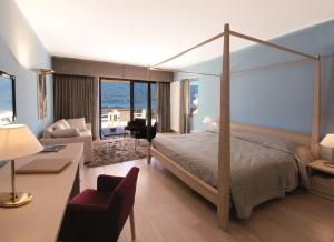 Rúm í herbergi á Hotel Ascona