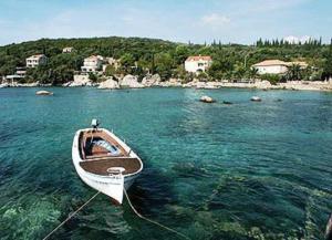 a boat in a body of water at Villa Peragic in Molunat