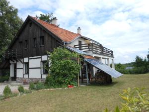 a house with a solarium on the side of it at Baza Ck in Giżycko