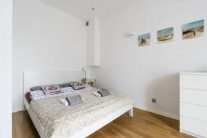 Cama o camas de una habitación en Budgetplus Key Apartaments Pańska