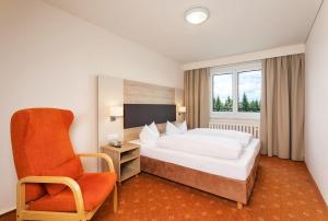 Postel nebo postele na pokoji v ubytování Hotel Am Bühl + 35 fotografií