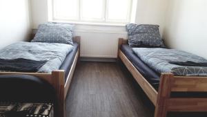 Posteľ alebo postele v izbe v ubytovaní Apartment MDK Sokolov