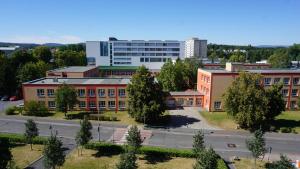 an overhead view of a school building with a street at Apartment MDK Sokolov in Sokolov