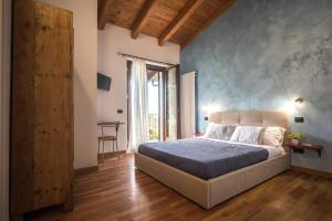 מיטה או מיטות בחדר ב-B&B Al Sentiero