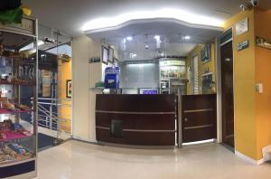 a store front with a brown door in a store at Hotel Bahia in Villavicencio