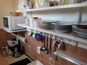 A kitchen or kitchenette at Ózon Apartment