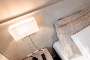 Rúm í herbergi á Albergo Ristorante Svizzero