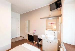 Rúm í herbergi á Albergo Ristorante Svizzero