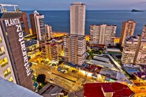 an aerial view of a city at night at Hotel Madeira Centro in Benidorm