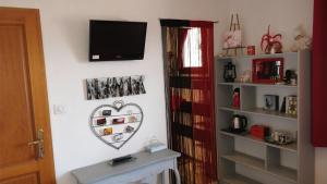 a living room with a heart on the wall at L'Oustalet in Sisteron