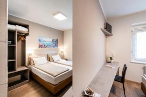Rúm í herbergi á Albergo Ristorante Svizzero