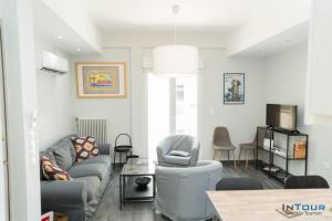 a living room with a couch and chairs at Art point under Acropolis in Athens