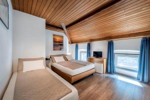 Rúm í herbergi á Albergo Ristorante Svizzero