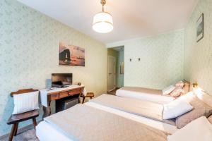 Rúm í herbergi á Albergo Ristorante Svizzero