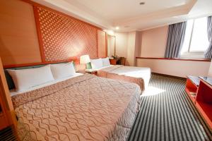 Postel nebo postele na pokoji v ubytování Monalisa Hotel