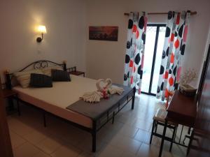 Posteľ alebo postele v izbe v ubytovaní Amfi Apartments