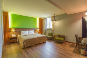 Postel nebo postele na pokoji v ubytování Monalisa Hotel
