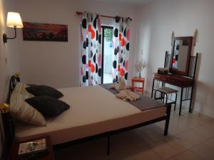 Posteľ alebo postele v izbe v ubytovaní Amfi Apartments