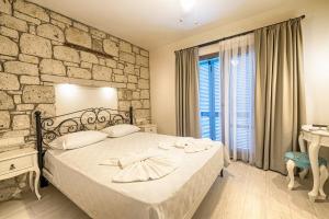 Postel nebo postele na pokoji v ubytování Bademli Konak Otel
