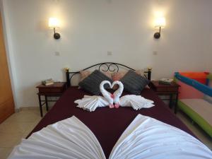 Posteľ alebo postele v izbe v ubytovaní Amfi Apartments