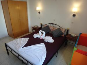 Posteľ alebo postele v izbe v ubytovaní Amfi Apartments