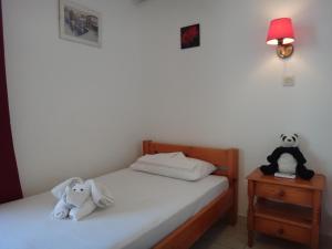Posteľ alebo postele v izbe v ubytovaní Amfi Apartments